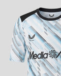 Shoulder and chest close up of the jersey highlighting the crest on the left chest and the blue diagonal pattern
