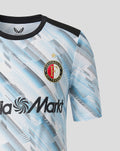 Front close up of the junior Feyenoord away shirt showing crest on the left chest, diagonal blue print, and Media Markt sponsor across the front