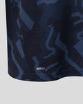 Close up of navy camouflage fabric with AERTEK imprint along the shirt hem.