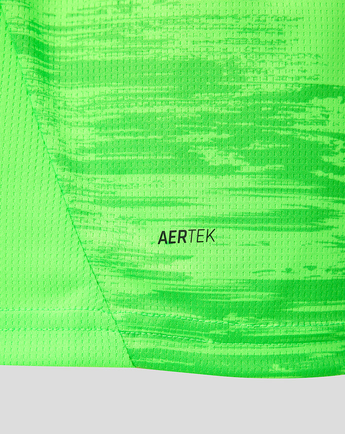 Close up of neon green keeper shirt featuring AERTEK fabric label.