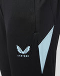 Close-up of Feyenoord Training 2026-2027 Junior pants showing black fabric, a light blue side panel and a Castore logo