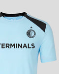 Light blue Feyenoord training shirt with a black shoulder panel and the club crest on the chest, plus a bold sponsor across the front