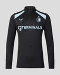 Front view of the men's Feyenoord coaches midlayer in black with light blue shoulder panels and a quarter zip, featuring sponsor and team logos.