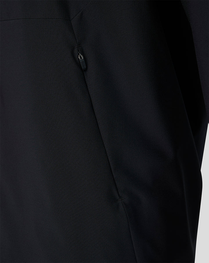 Close-up of a black Feyenoord training jacket showing a zip pocket and seam detail