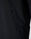 Close-up of a black Feyenoord training jacket showing a zip pocket and seam detail