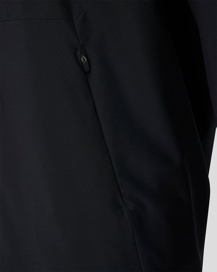 Close-up of a black Feyenoord training jacket showing a zip pocket and seam detail
