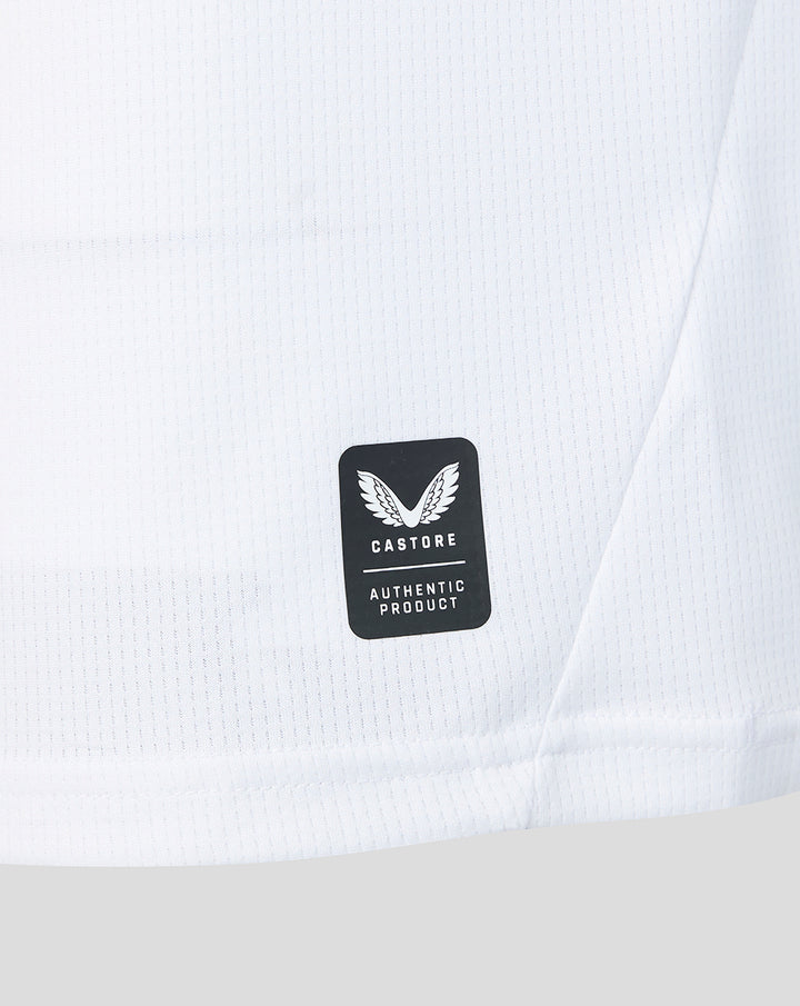 White jersey fabric close up with Castore authentic product badge.