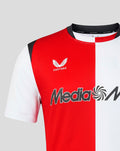 Close-up of Feyenoord home shirt showing red white panels with Castore branding at the collar and sponsor across the chest