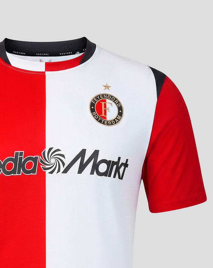 Feyenoord home shirt front with a red and white split design, left chest club crest and Media Markt sponsor across the torso.