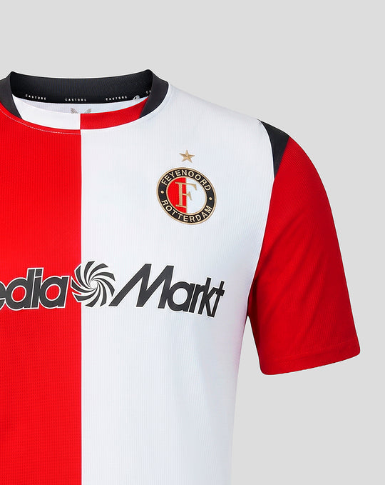Close-up of Feyenoord Pro Thuisshirt with red white vertical split, club crest on chest and Media Markt sponsor across front.