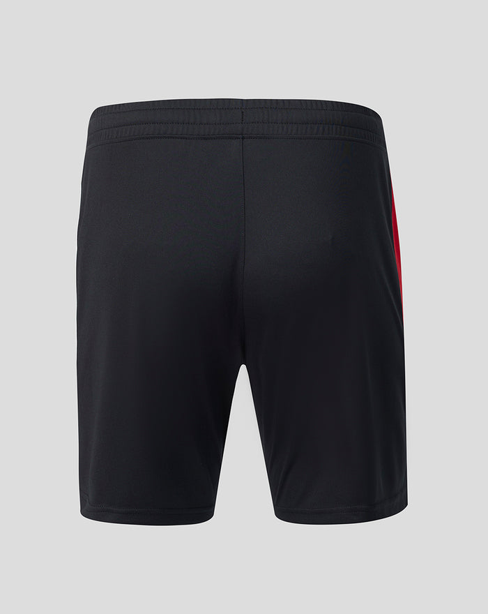 Back view of black Feyenoord home shorts with elastic waistband and bold red side stripe.