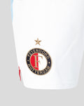 Close up of the Feyenoord Rotterdam emblem embroidered on white shorts with a gold star above
