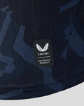 Close up of navy patterned fabric with Castore authentic product badge on Feyenoord shirt