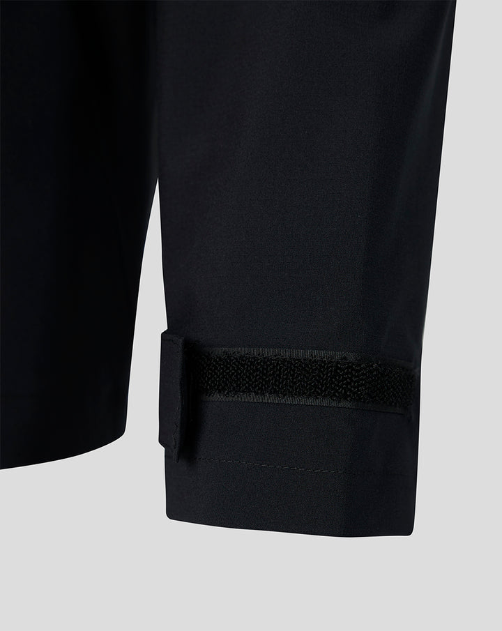 Close up of the Feyenoord training Regenjas cuff with Velcro strap on dark water resistant fabric.