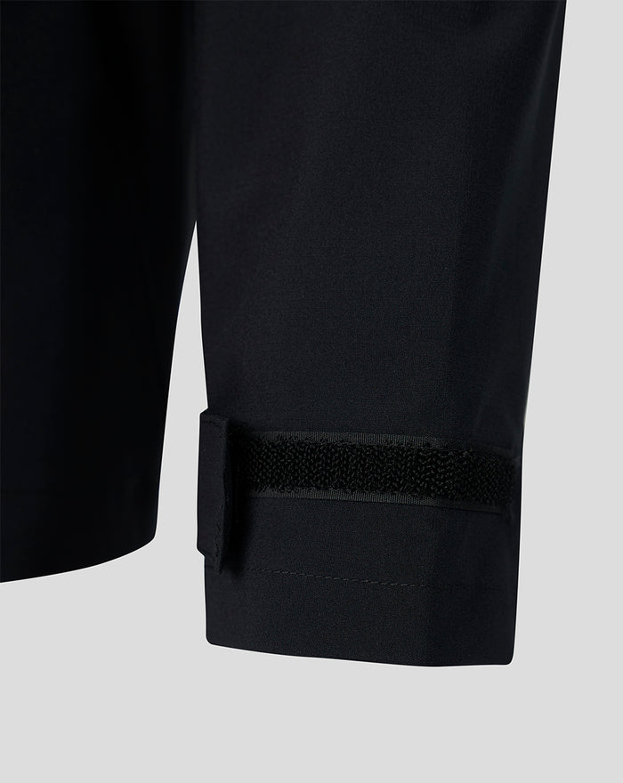 Close up of the Feyenoord training Regenjas cuff with Velcro strap on dark water resistant fabric.