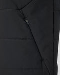 Close-up of a black Feyenoord training gilet featuring an angled zip pocket