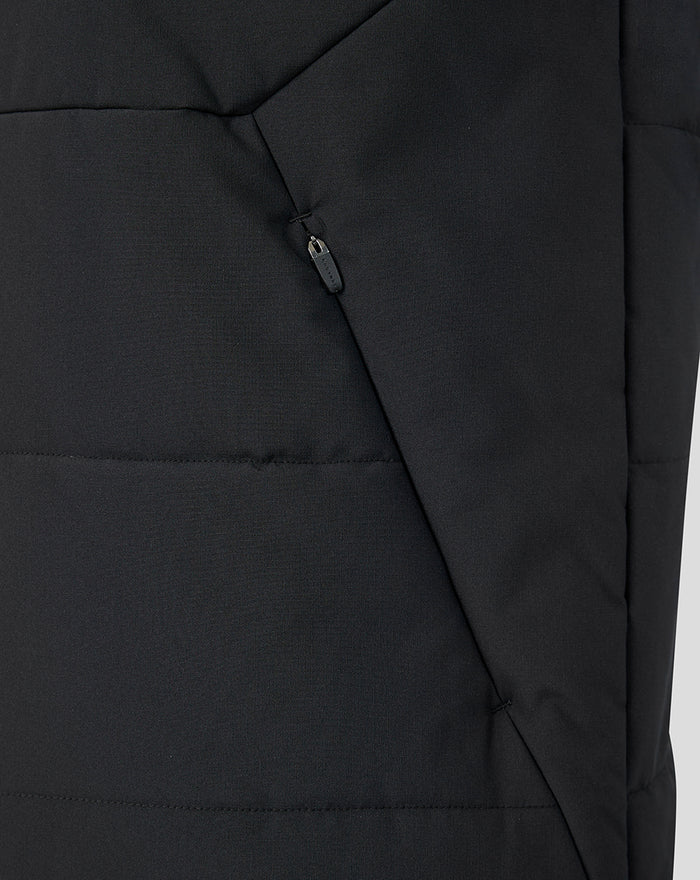 Close-up of a black Feyenoord training gilet featuring an angled zip pocket