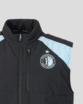Front view of a black Feyenoord training gilet with light blue panels and the Feyenoord badge on the left chest and Castore logo on the right.