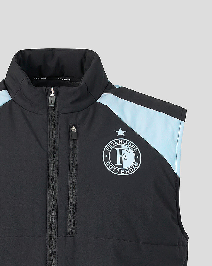 Front view of a black Feyenoord training gilet with light blue panels and the Feyenoord badge on the left chest and Castore logo on the right.