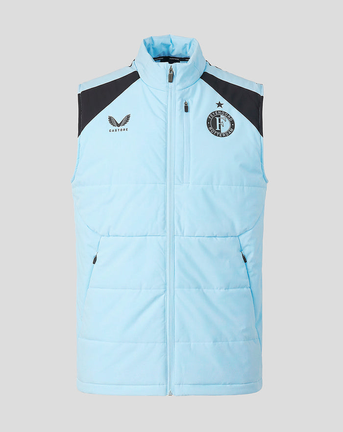 Front view of a light blue Feyenoord training vest with black shoulder panels and a full front zipper.