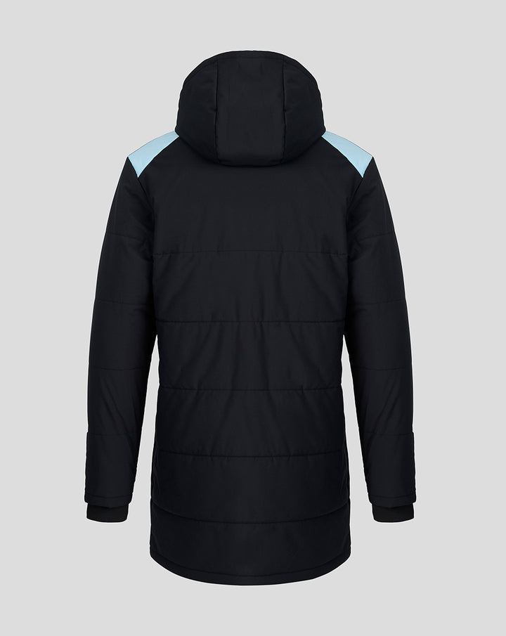 Back view of a black padded Feyenoord coach jacket with light blue shoulder panels and a hood