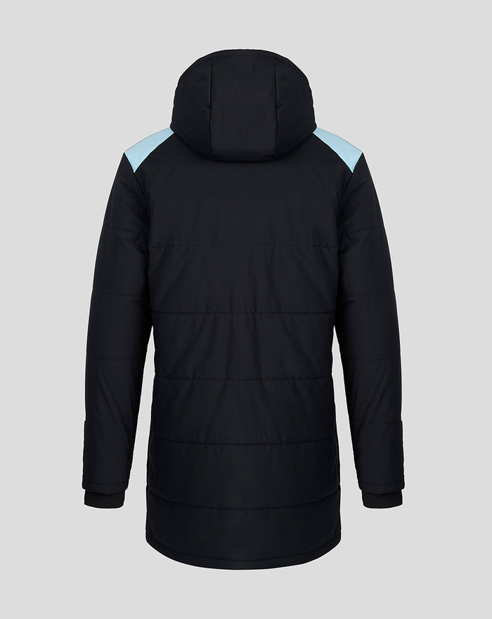 Back view of a black padded Feyenoord coach jacket with light blue shoulder panels and a hood