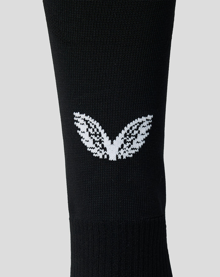 Close up of black Feyenoord home sock with white Feyenoord F emblem on the shin
