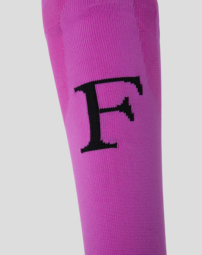 Bright pink Feyenoord third keeper sock for adults with a bold black F on the shin