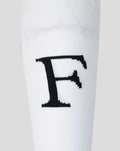 Close-up of a white Feyenoord Thuis Wissel sock for adults showing a bold black F on the leg