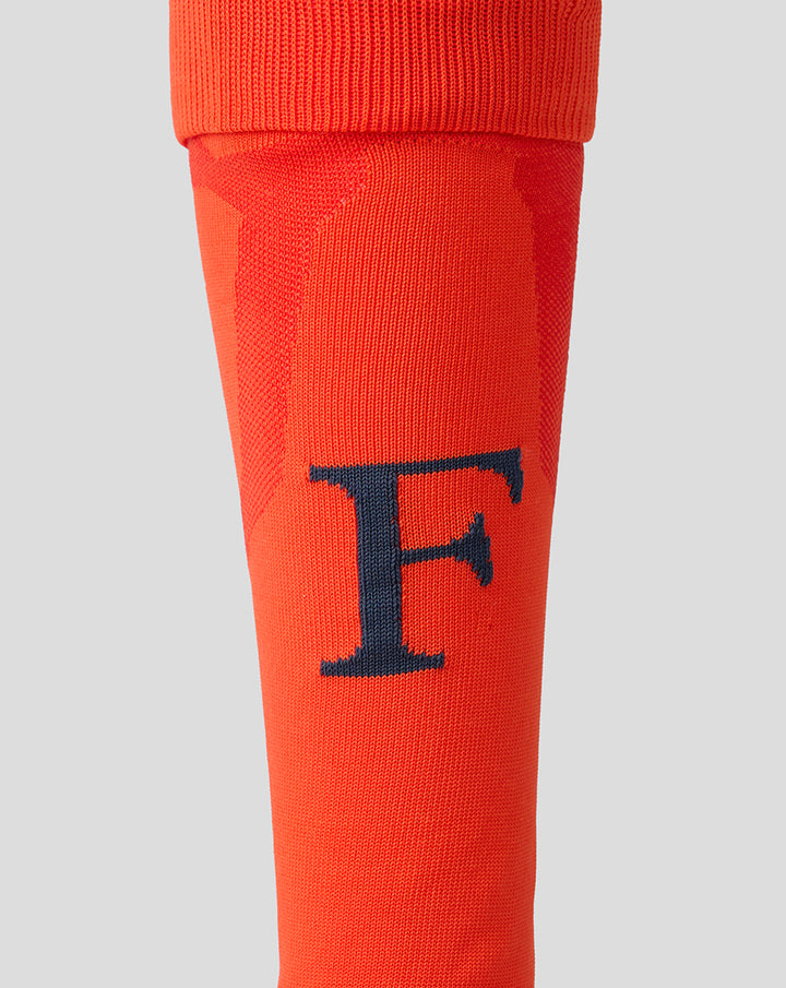 Orange Feyenoord third alternate sock for adults with a navy F on the shin