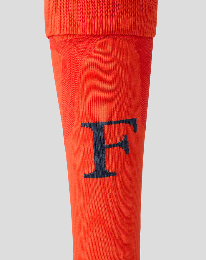 Orange Feyenoord third alternate sock for adults with a navy F on the shin