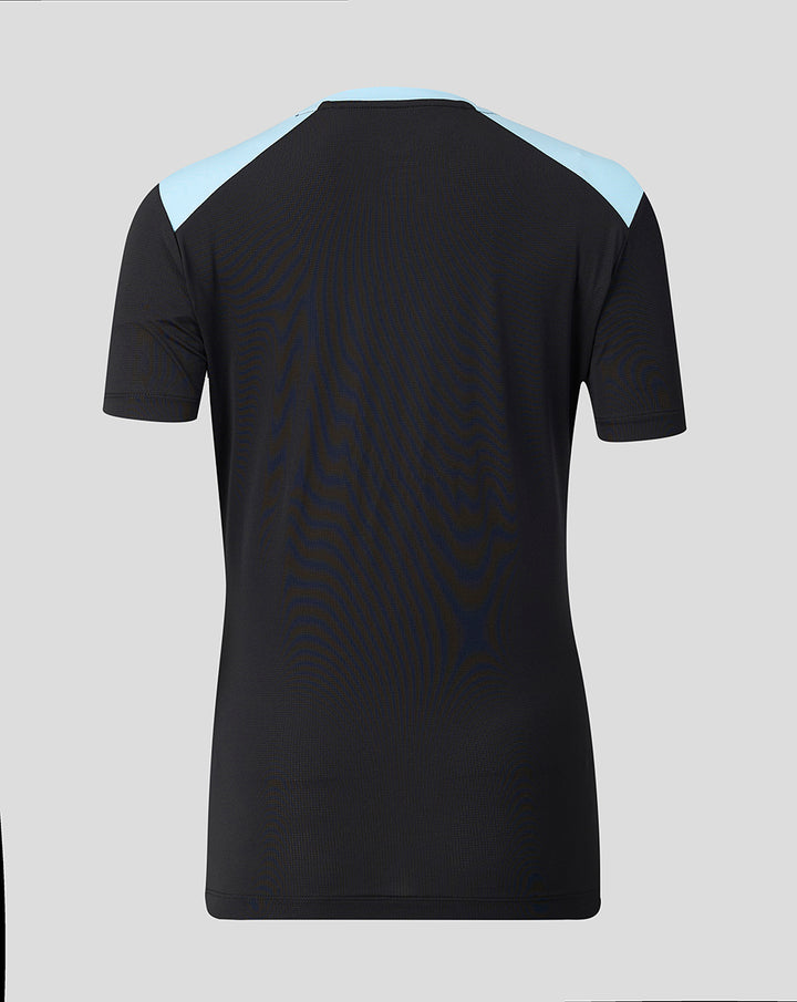 Back view of the black Feyenoord training coaches T shirt for women with light blue shoulder panels