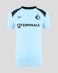 Front view of women's light blue Feyenoord training shirt with black shoulder panels, Feyenoord crest and large sponsor logo across the chest.