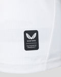 White jersey fabric detail with small perforations and a Castore Authentic Product label