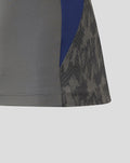 Side view of the Feyenoord training shirt with blue panel and dark patterned sleeve.