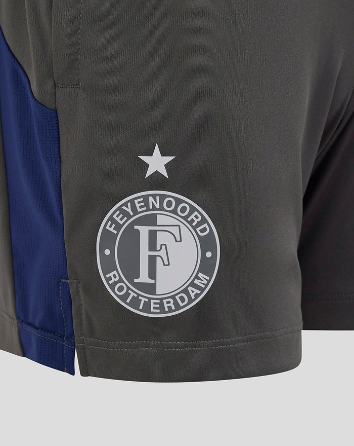 Close-up of the left leg showing the Feyenoord crest and star on dark gray training shorts.