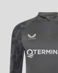Shoulder and chest close-up highlighting Castore logo and a geometric sleeve pattern on the Feyenoord training midlayer.