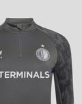 Front chest close-up showing Castore logo on one side, Feyenoord crest on the other, and TERMINALS across the torso.