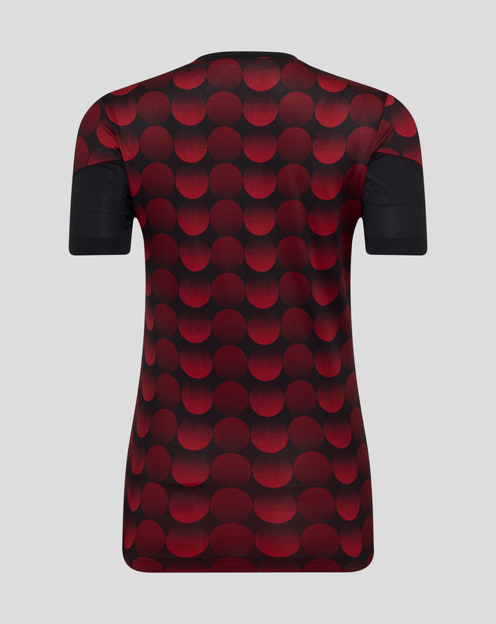 Back view of a women's Feyenoord home matchday T-shirt with a bold red polka dot pattern on black fabric and short sleeves