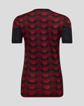 Back view of a women's Feyenoord home matchday T-shirt with a bold red polka dot pattern on black fabric and short sleeves