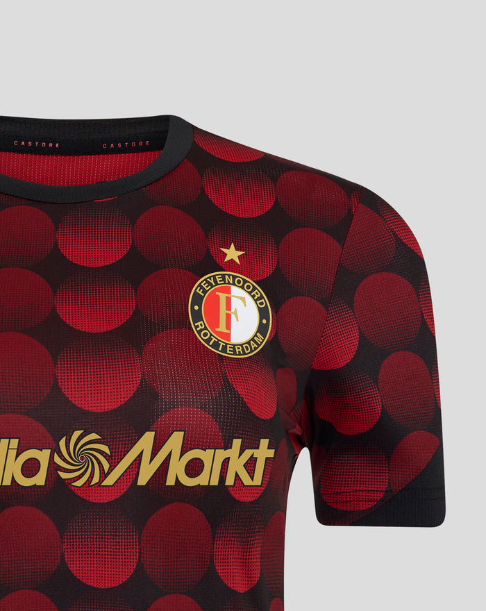 Close-up of Feyenoord women's home jersey with red dotted pattern crest and star, featuring CASTORE branding at the collar.