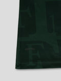 Back lower section of dark green Feyenoord jersey with an all over pattern and a large Media Markt sponsor across the hem