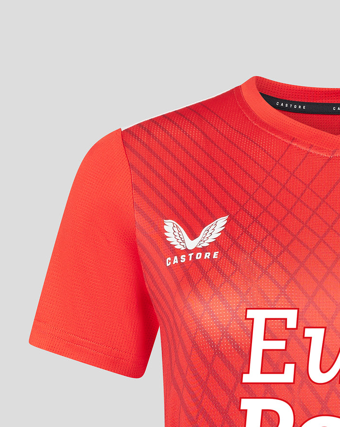 Red Feyenoord home women's warm-up T shirt close up showing Castore logo and club badge on chest