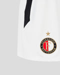 Close-up of white Feyenoord Pro women's third shorts with crest on lower right and black side stripe.