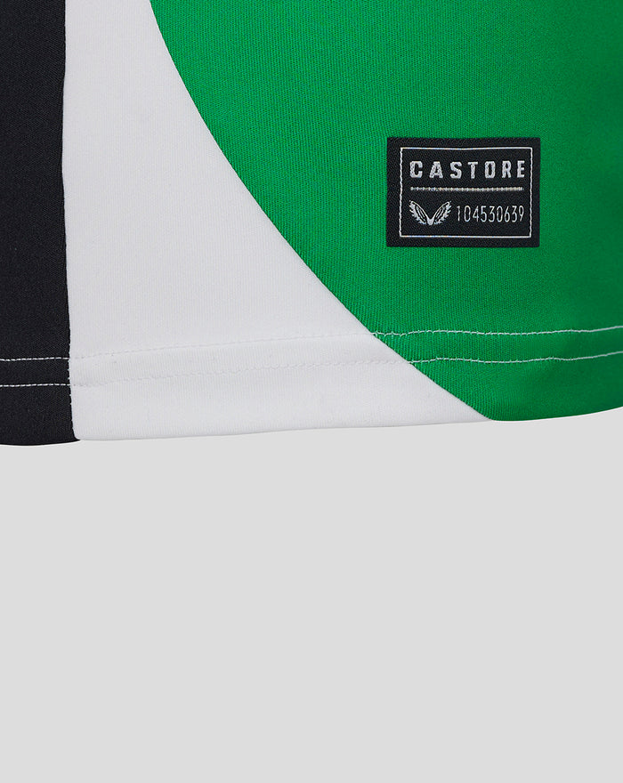 Detail of the Feyenoord third shirt showing a Castore label stitched near the hem on the green panel.