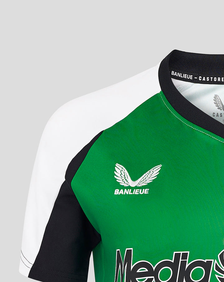 Close-up of the women's Feyenoord third shirt showing the green chest panel with Banlieue logo and Castore collar branding.