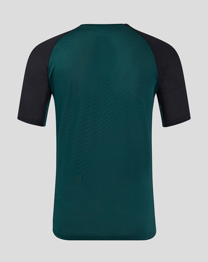 Back view of teal Feyenoord Pro Coach Training T-shirt for women with black raglan sleeves