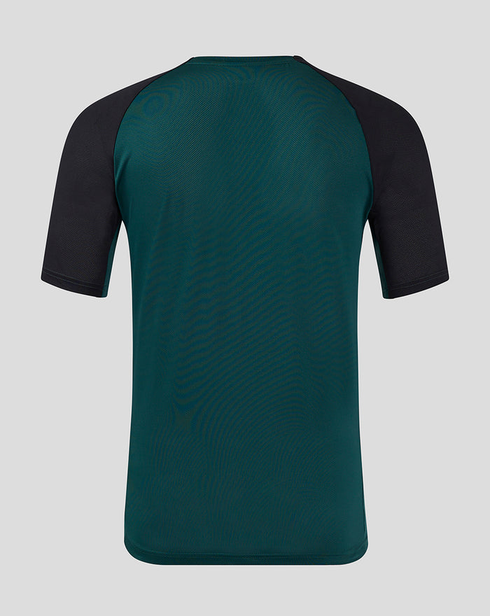 Back view of teal Feyenoord Pro Coach Training T-shirt for women with black raglan sleeves