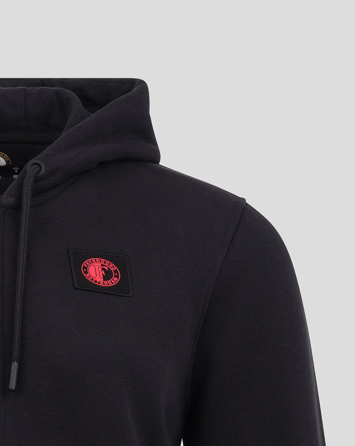 Left chest close up of a dark navy Feyenoord hoodie with red round logo patch