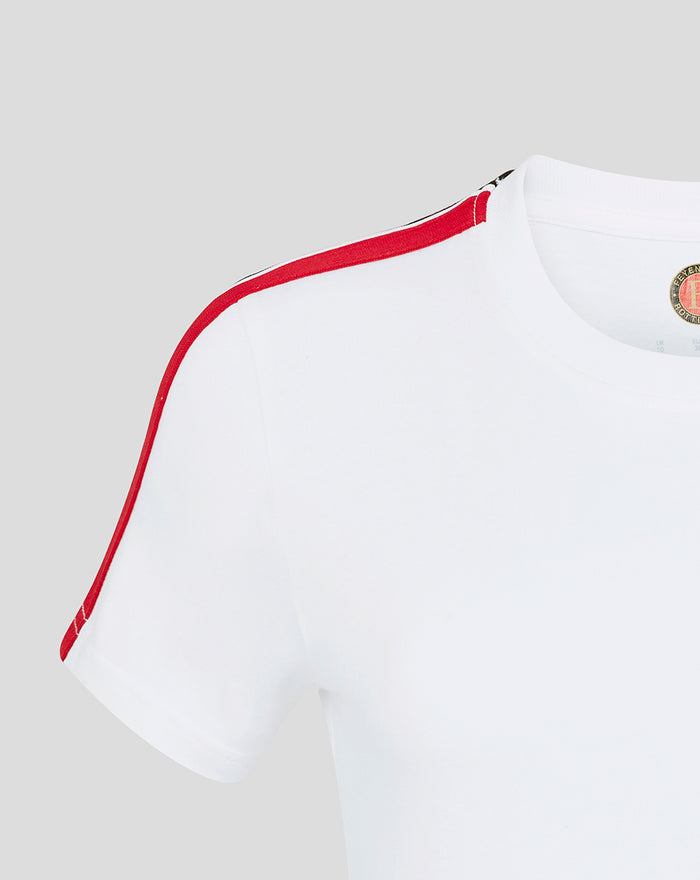 White women's Feyenoord T shirt close up of shoulder with red piping along the seam